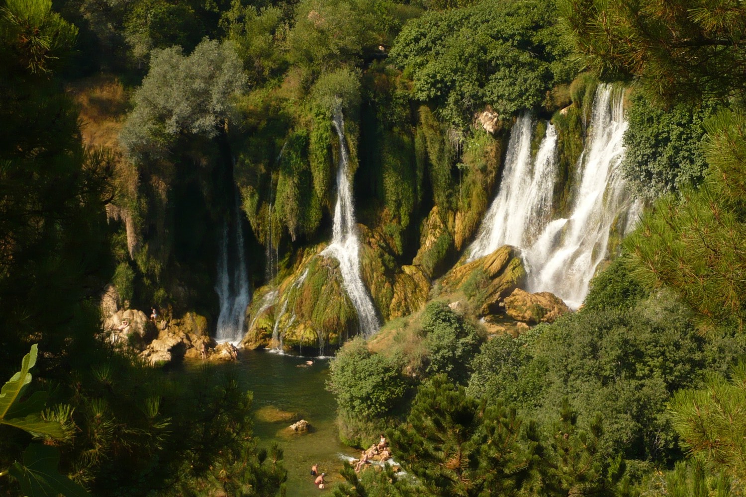 Kravica waterfalls surrounded by green landscape in Herzegovina